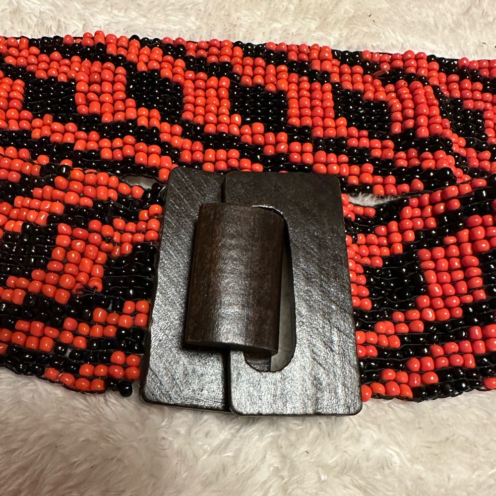 Seed bead Kensie belt from Anthropologie red-orange and black L/XL